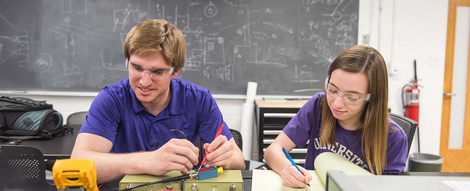 Two students working on a project in a lab