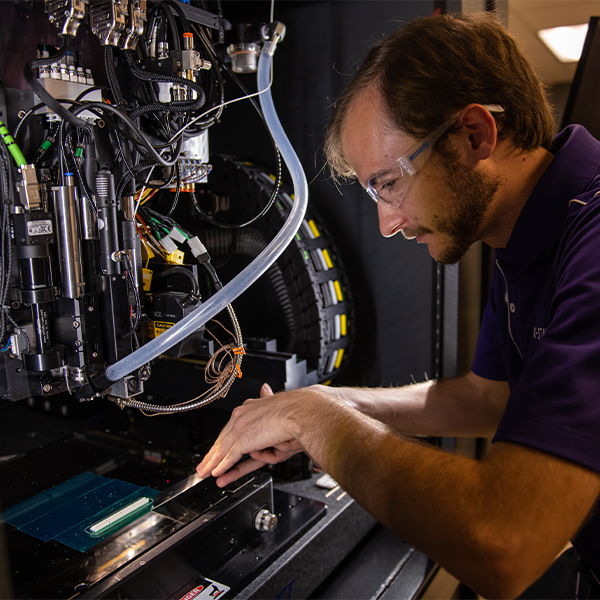 Student working with equipment in a lab